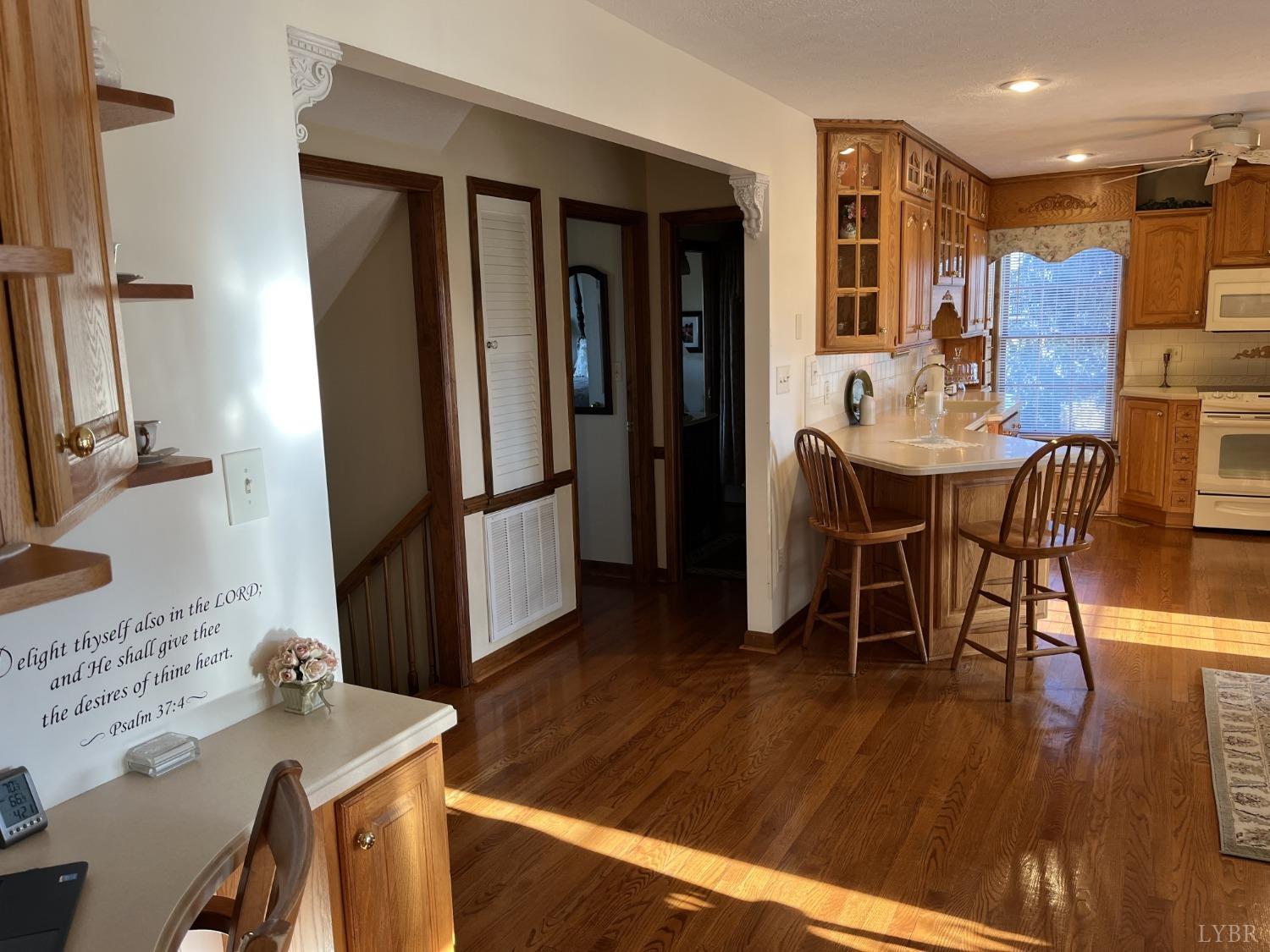3912 Lowry Road Goode, VA 24556 - Photo 13 of 56 a view of a dining room with furniture and wooden floor