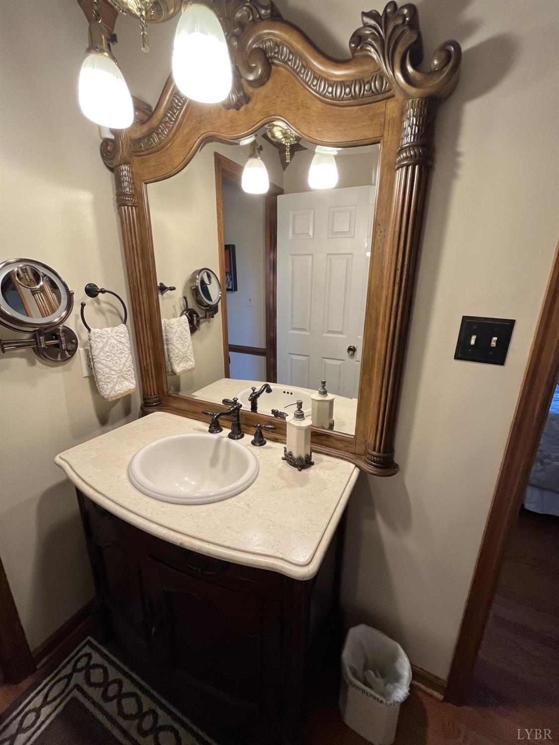 3912 Lowry Road Goode, VA 24556 - Photo 18 of 56 a bathroom with a sink and a mirror