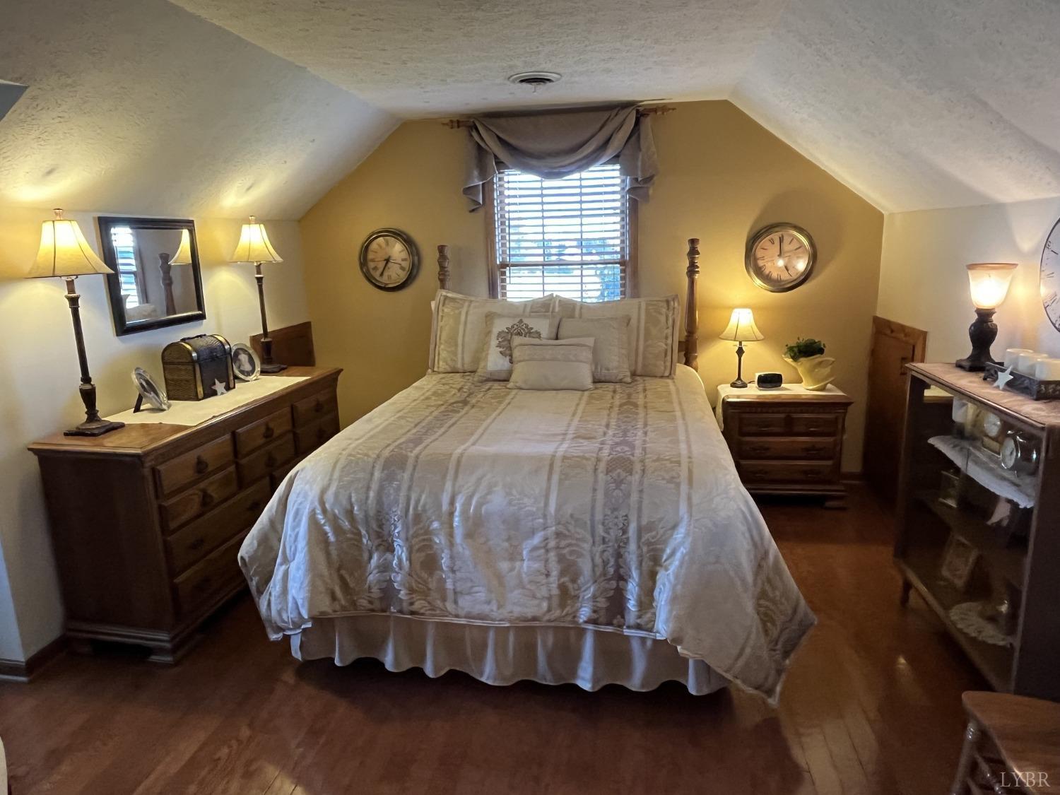 3912 Lowry Road Goode, VA 24556 - Photo 22 of 56 a bedroom with a bed and dresser