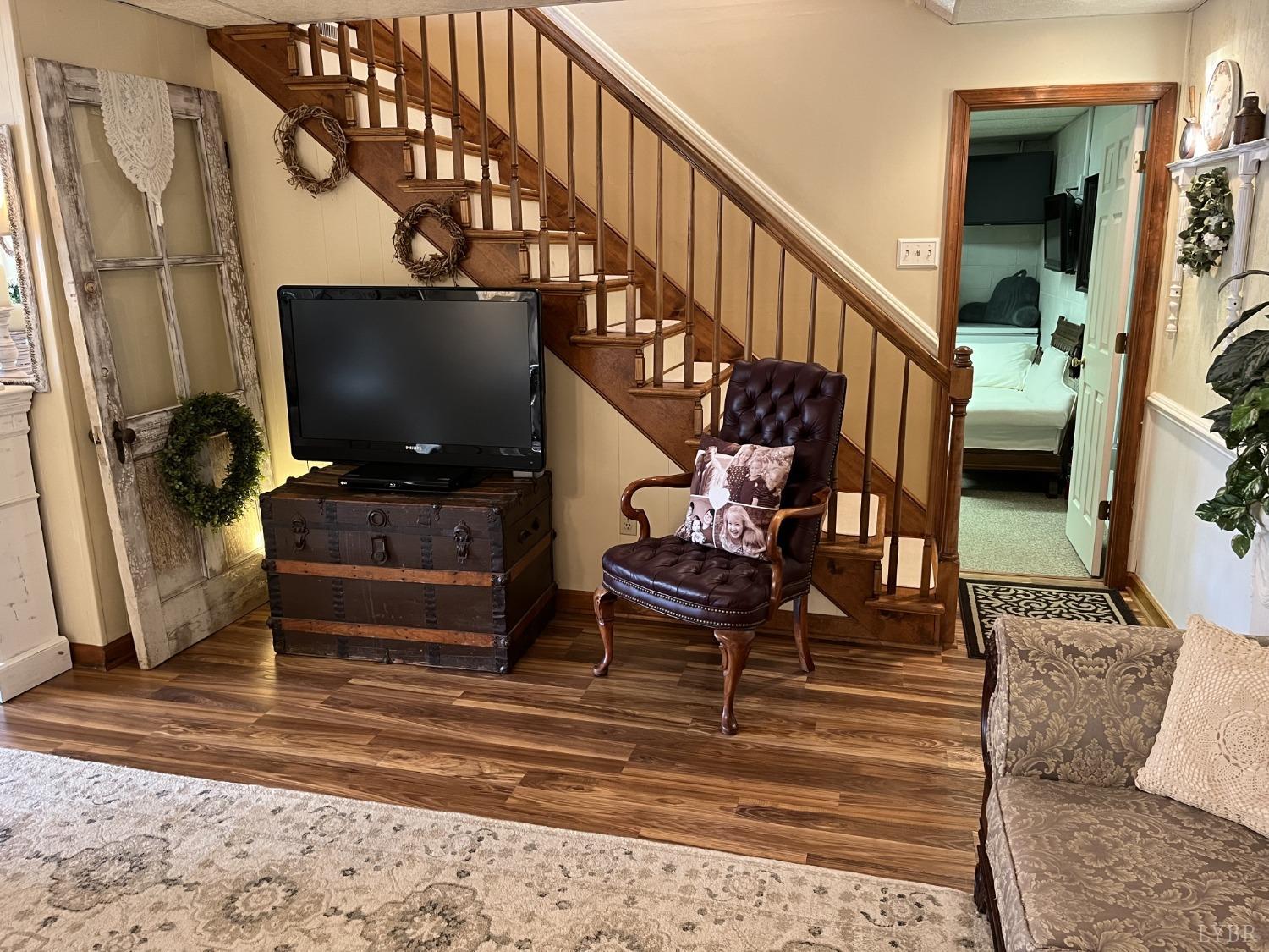 3912 Lowry Road Goode, VA 24556 - Photo 25 of 56 a living room with furniture and a flat screen tv