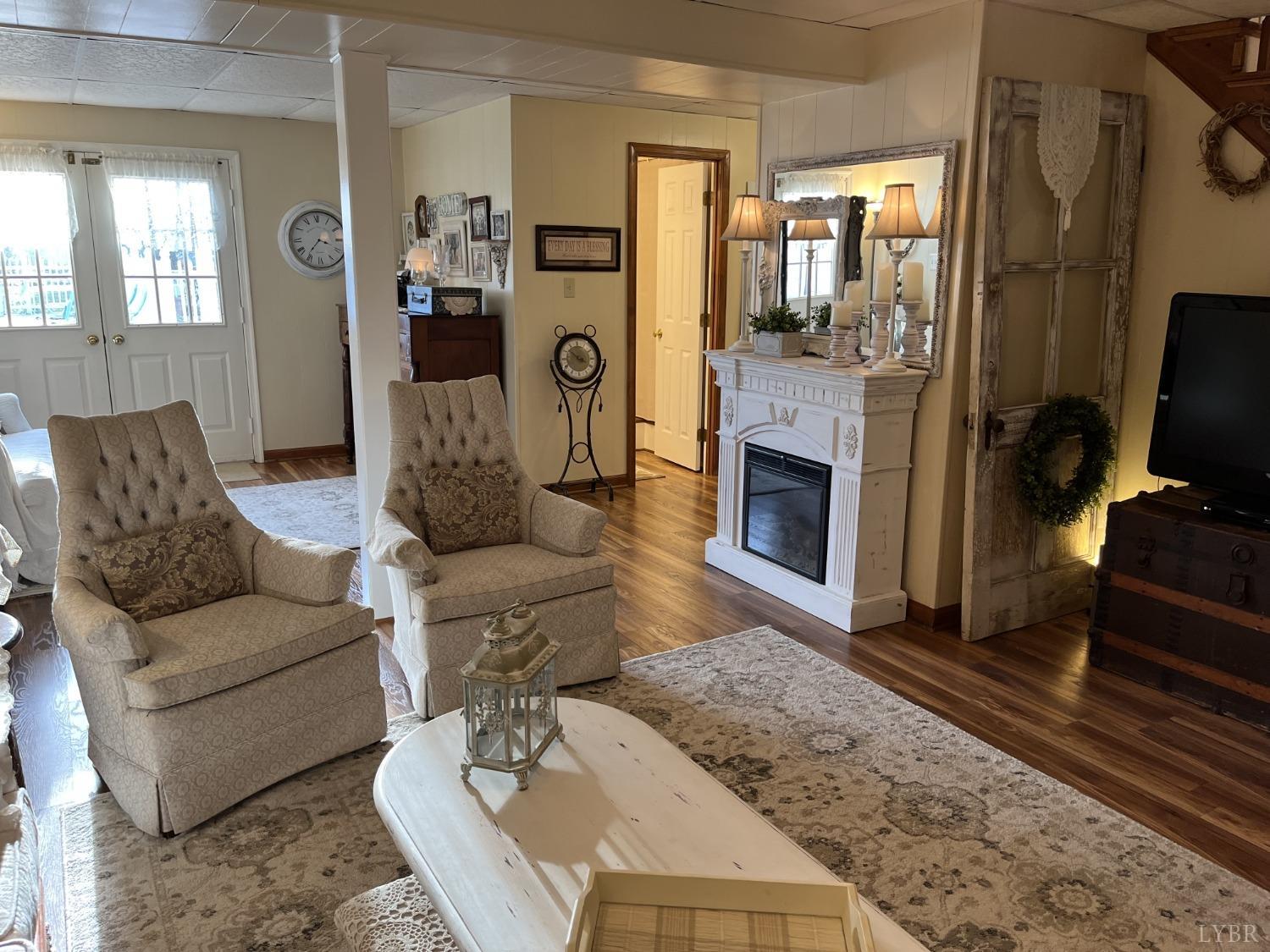 3912 Lowry Road Goode, VA 24556 - Photo 28 of 56 a living room with furniture and a fireplace