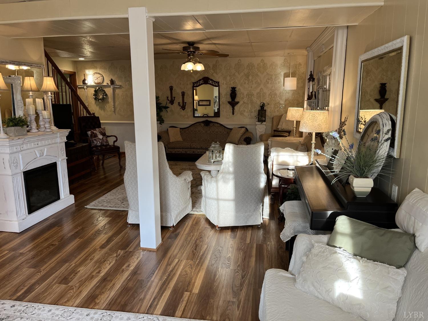 3912 Lowry Road Goode, VA 24556 - Photo 29 of 56 a living room with furniture and a fireplace