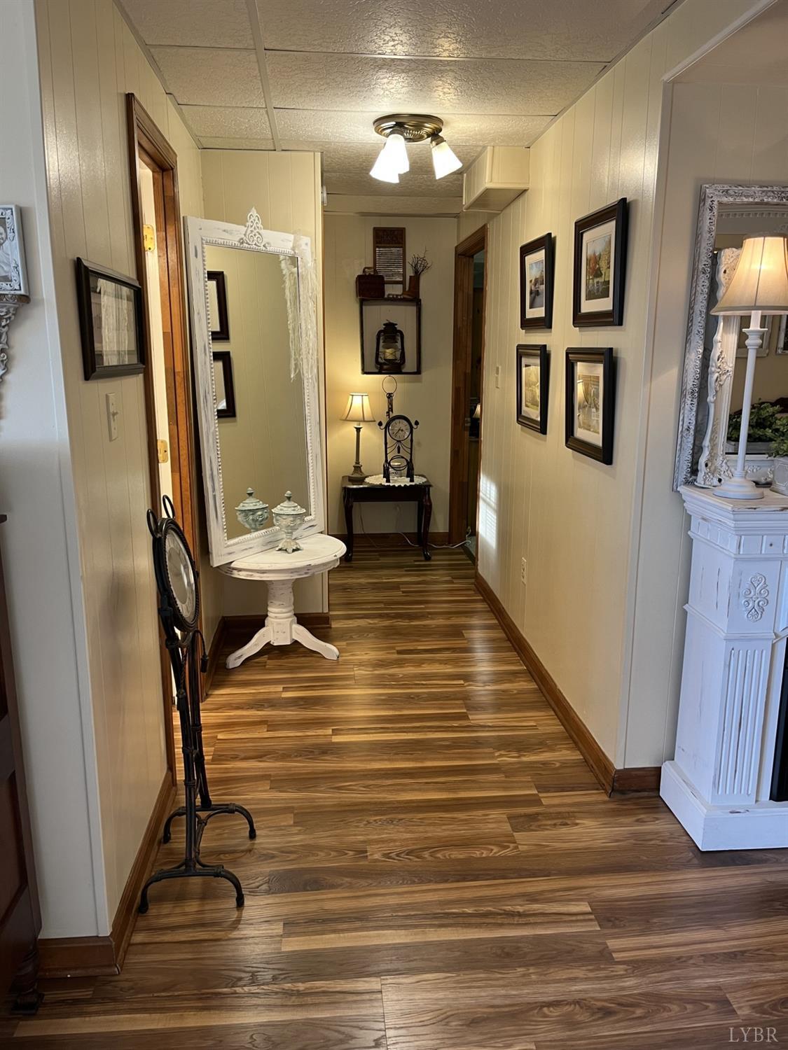 3912 Lowry Road Goode, VA 24556 - Photo 30 of 56 a view of a hallway with wooden floor and furniture