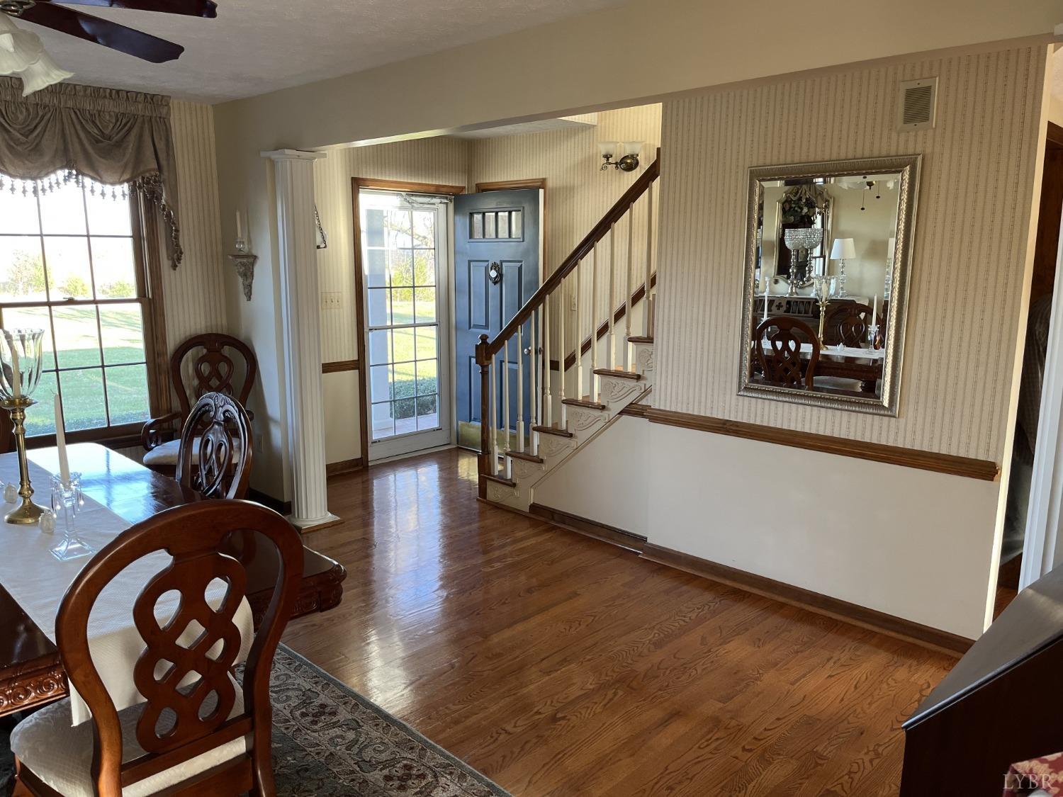 3912 Lowry Road Goode, VA 24556 - Photo 3 of 56 a view of staircase with furniture and a window