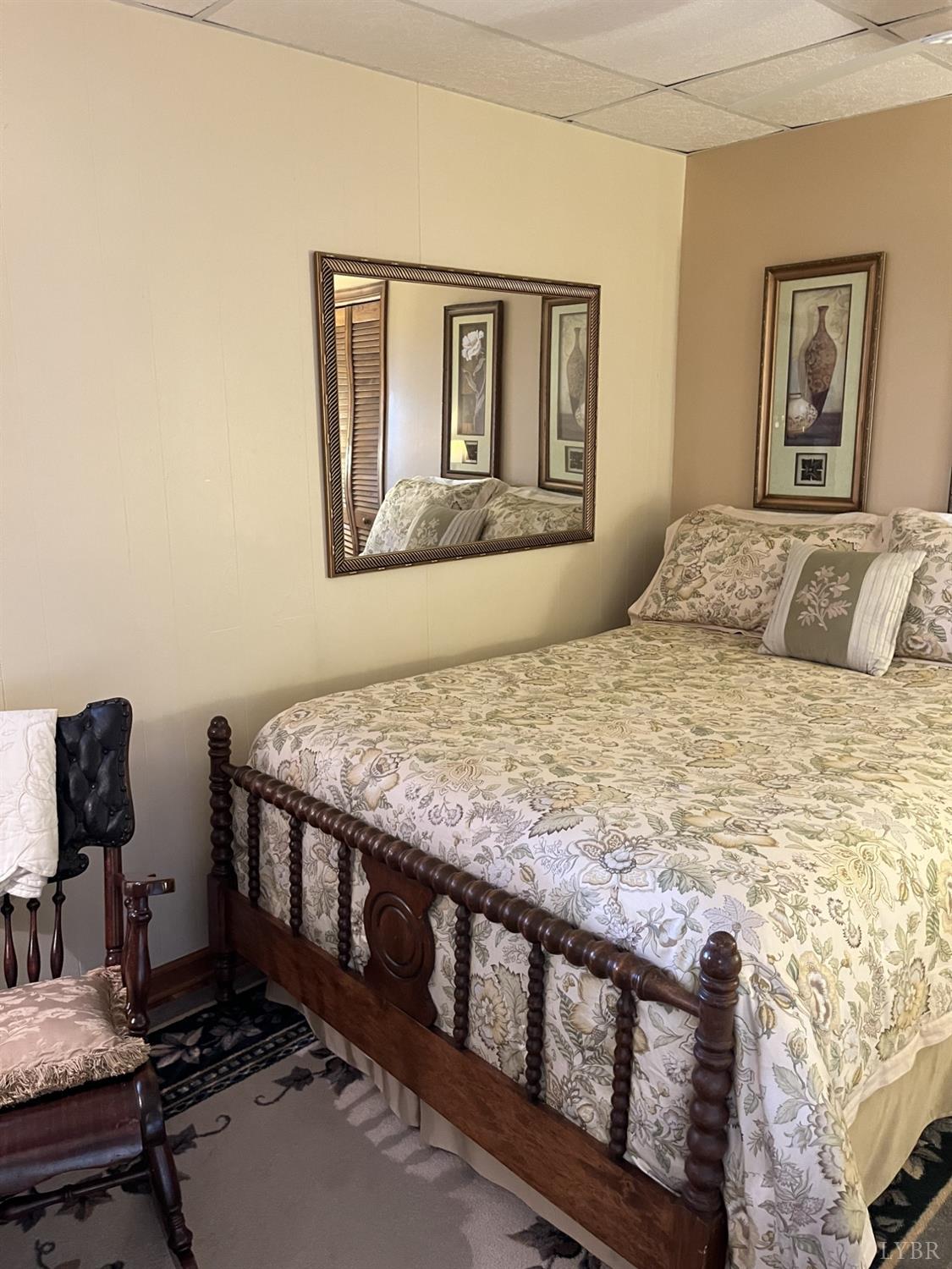 3912 Lowry Road Goode, VA 24556 - Photo 33 of 56 a bedroom with a bed and wooden floor