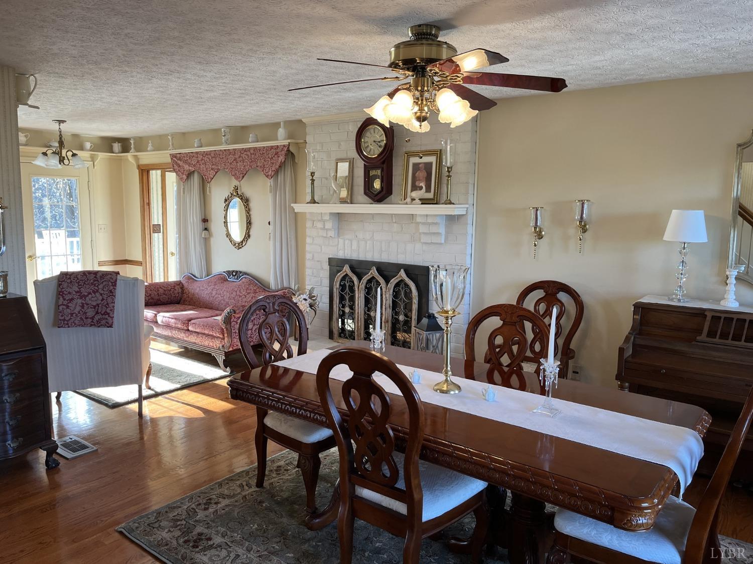 3912 Lowry Road Goode, VA 24556 - Photo 4 of 56 a view of a livingroom with furniture and a fireplace