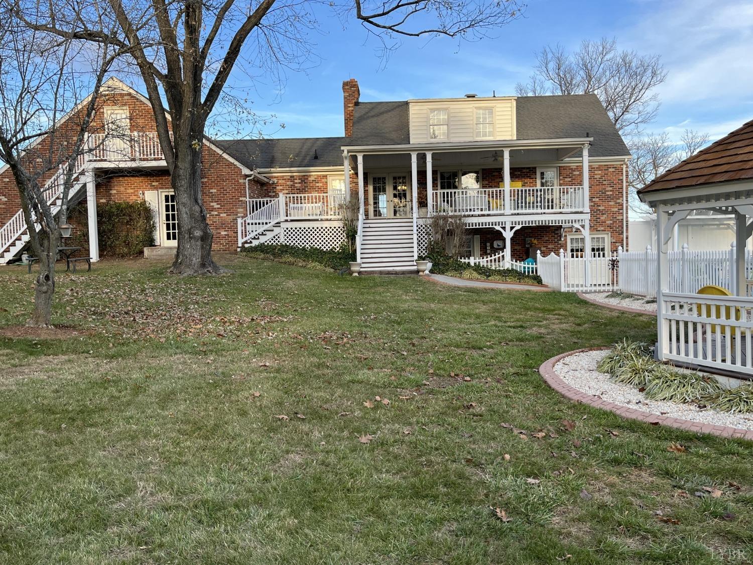 3912 Lowry Road Goode, VA 24556 - Photo 43 of 56 a front view of a house with a yard