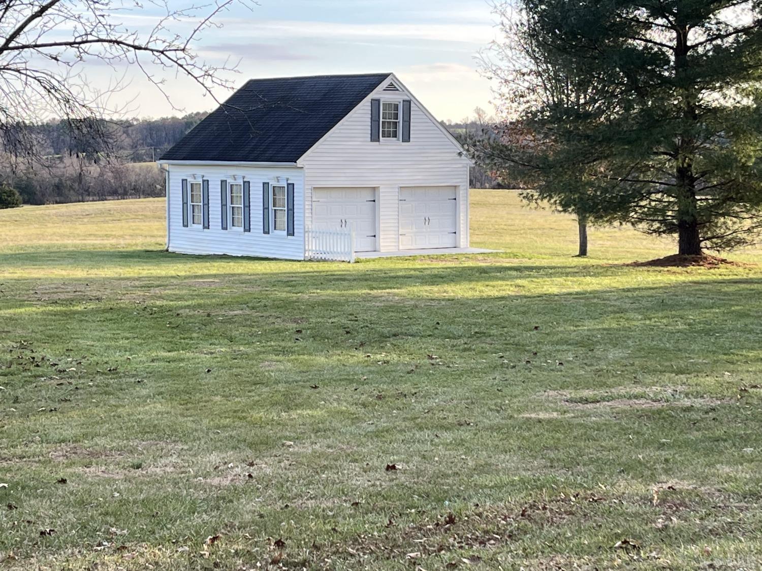 3912 Lowry Road Goode, VA 24556 - Photo 47 of 56 a front view of a house with a yard