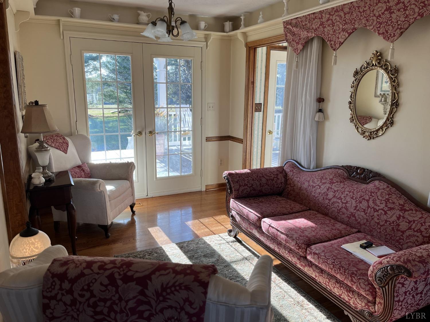 3912 Lowry Road Goode, VA 24556 - Photo 5 of 56 a living room with furniture and a large window