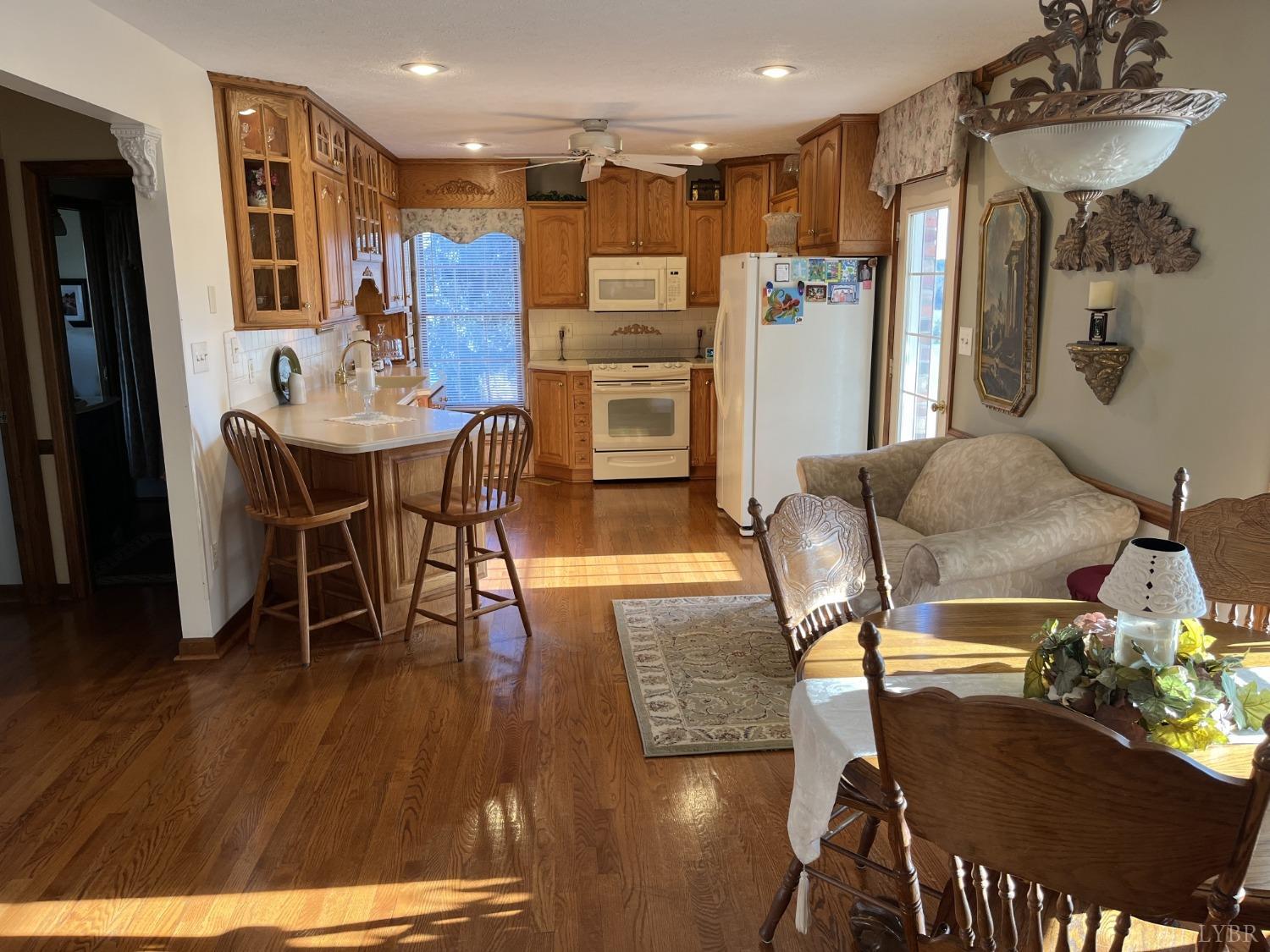 3912 Lowry Road Goode, VA 24556 - Photo 8 of 56 a view of a dining room with furniture and wooden floor