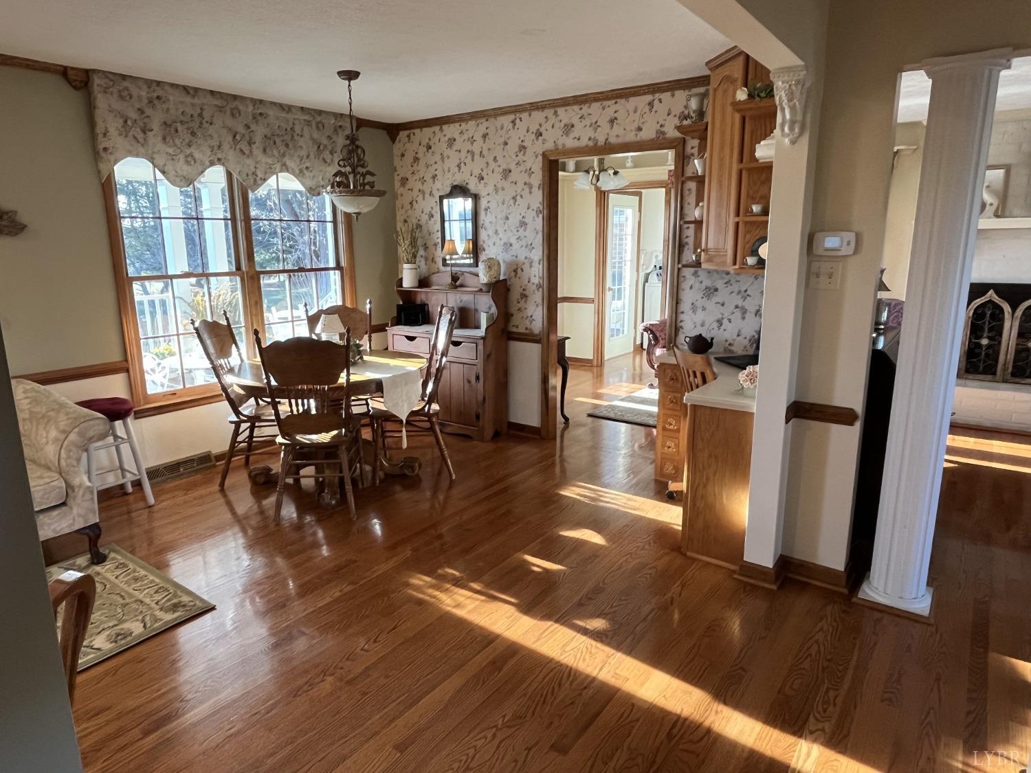 3912 Lowry Road Goode, VA 24556 - Photo 9 of 56 a view of a dining room with furniture window and wooden floor