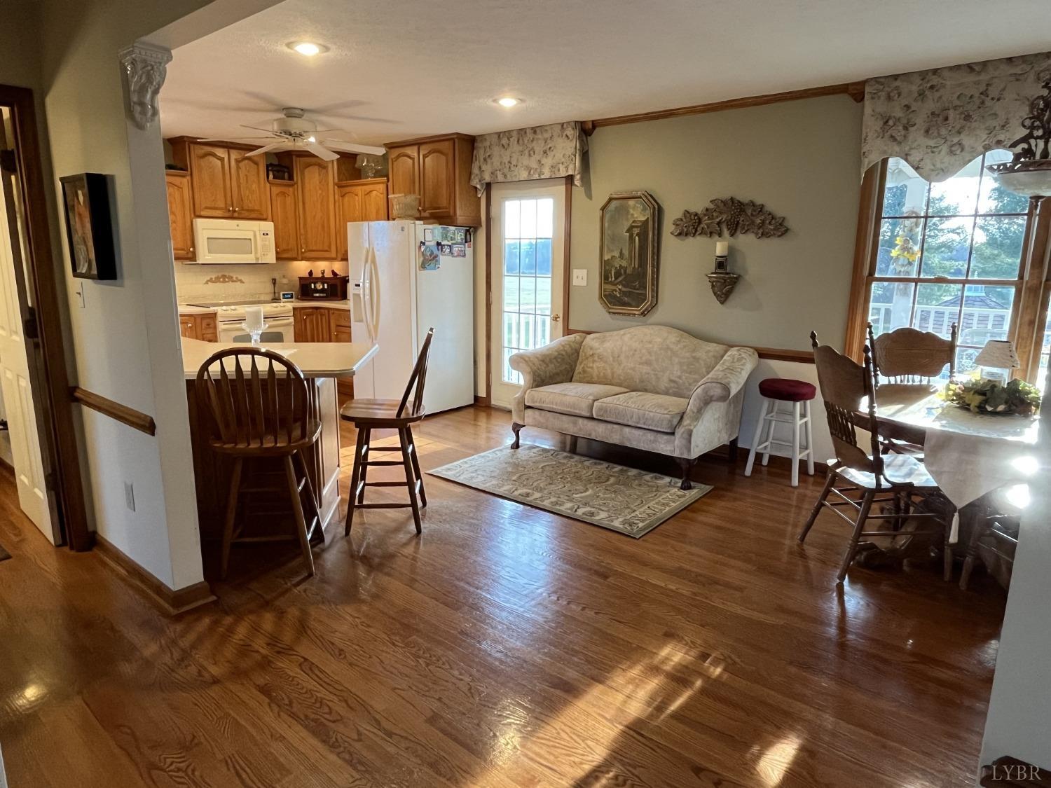 3912 Lowry Road Goode, VA 24556 - Photo 10 of 56 a living room with furniture rug and wooden floor