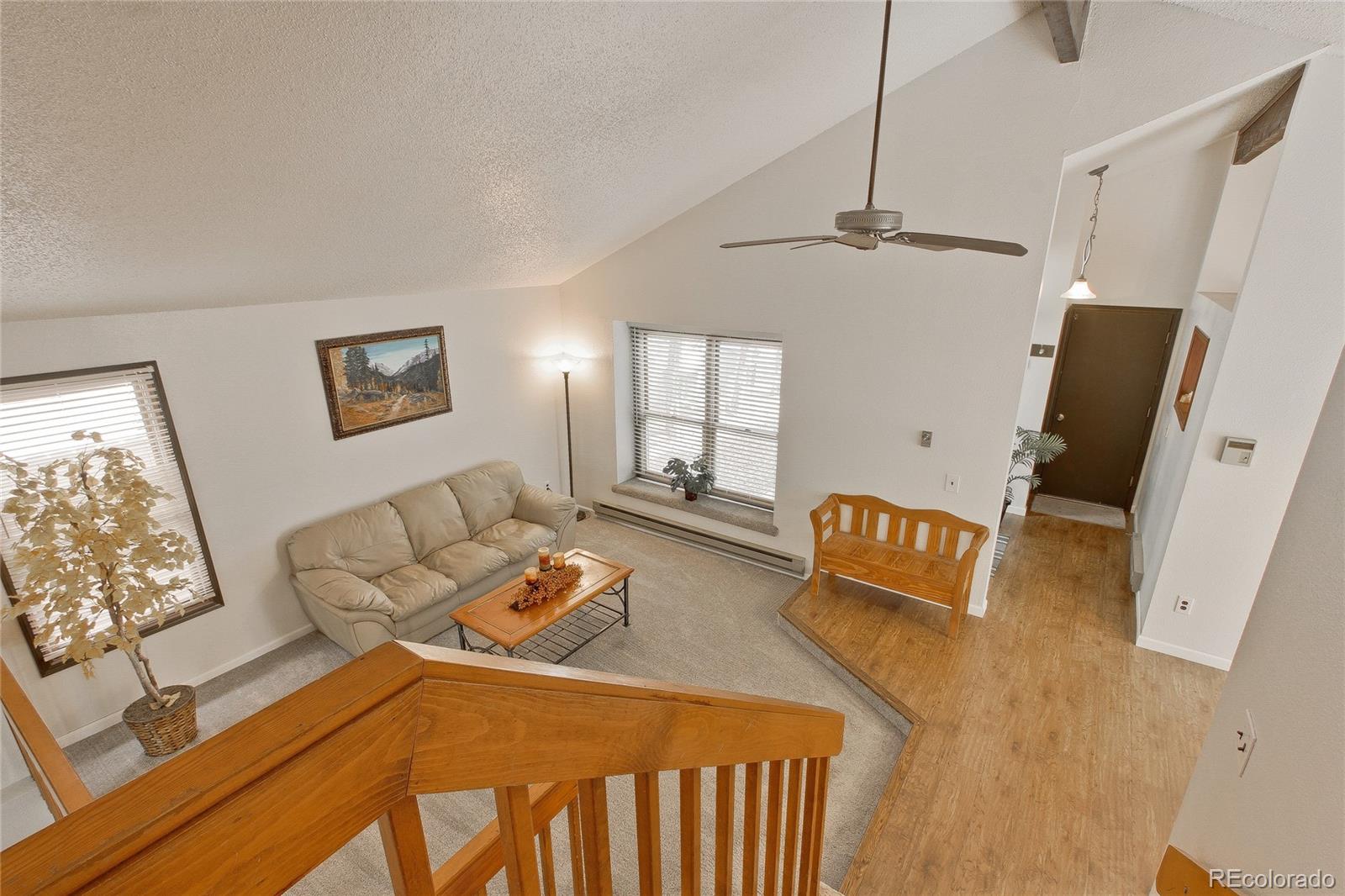 645 Wade Road Longmont, CO 80503 - Photo 5 of 32 a bedroom with furniture and a window