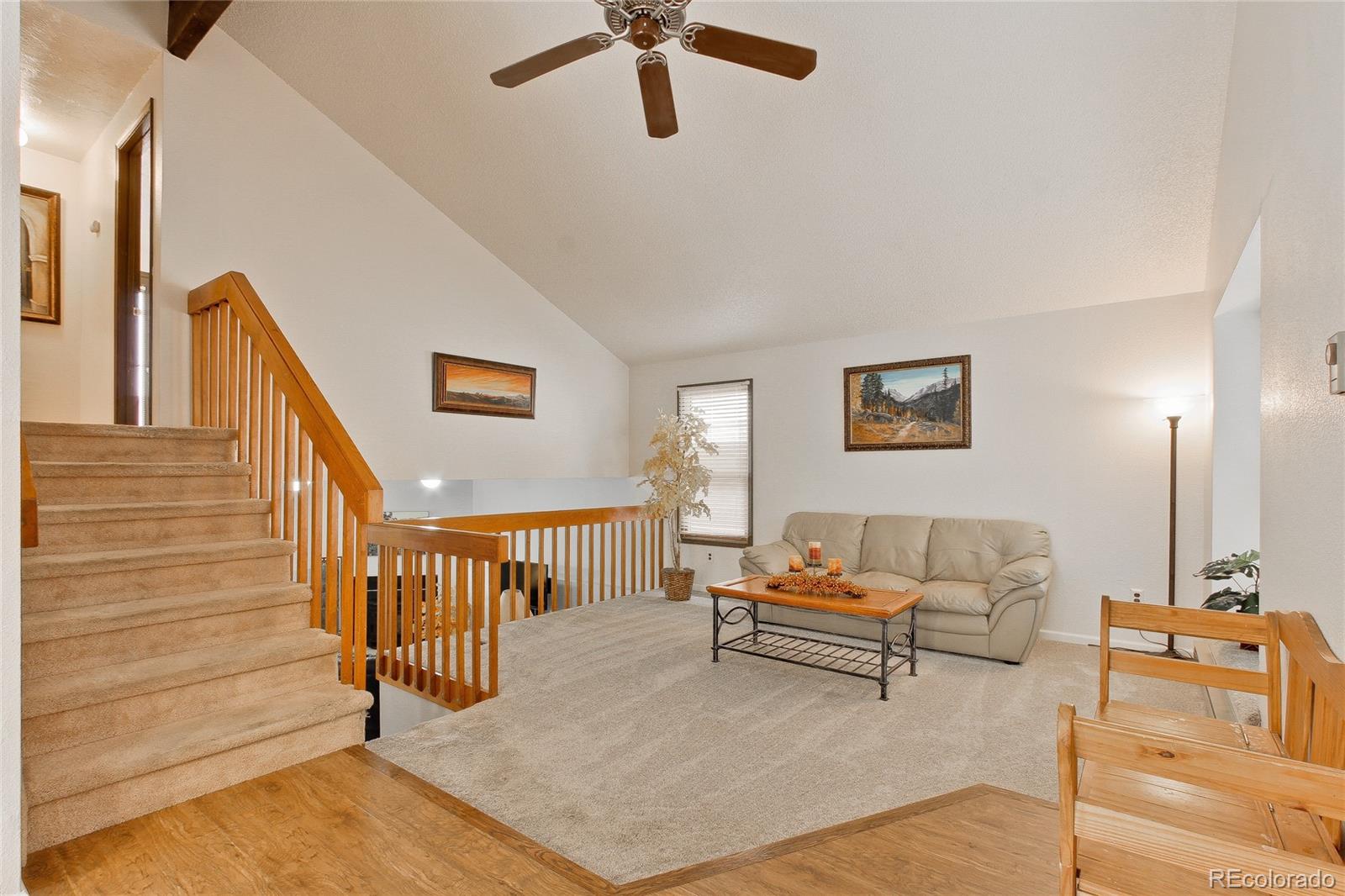 645 Wade Road Longmont, CO 80503 - Photo 6 of 32 a living room with furniture and a rug