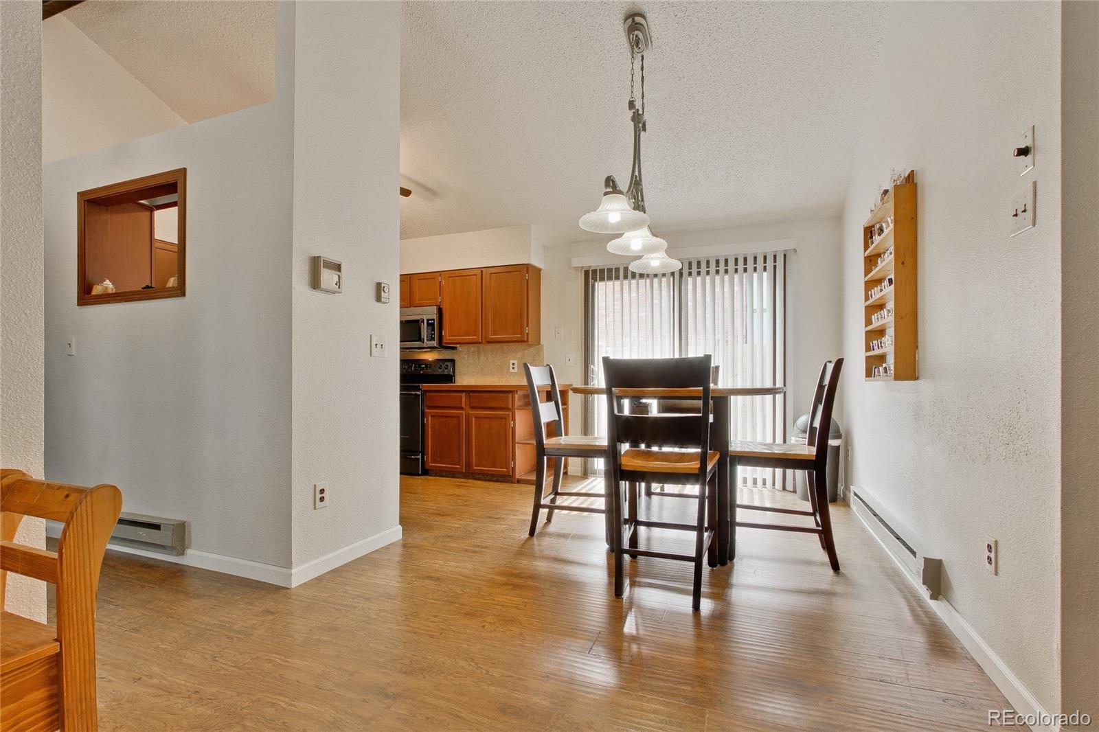 645 Wade Road Longmont, CO 80503 - Photo 8 of 32 a view of a dining room with furniture