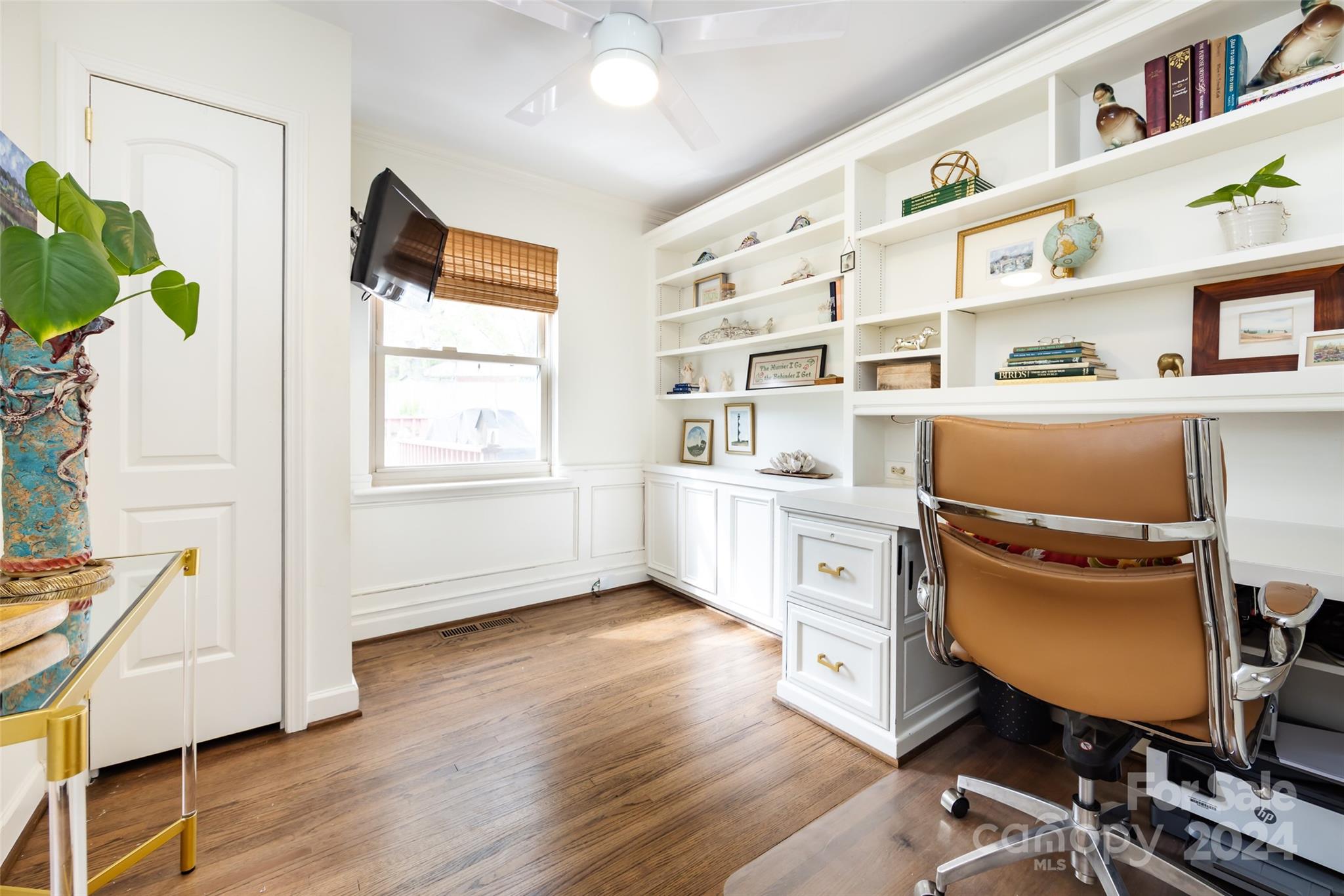 4820 Murrayhill Road Charlotte, NC 28209 - Photo 18 of 31 a view of a workspace with furniture and a window