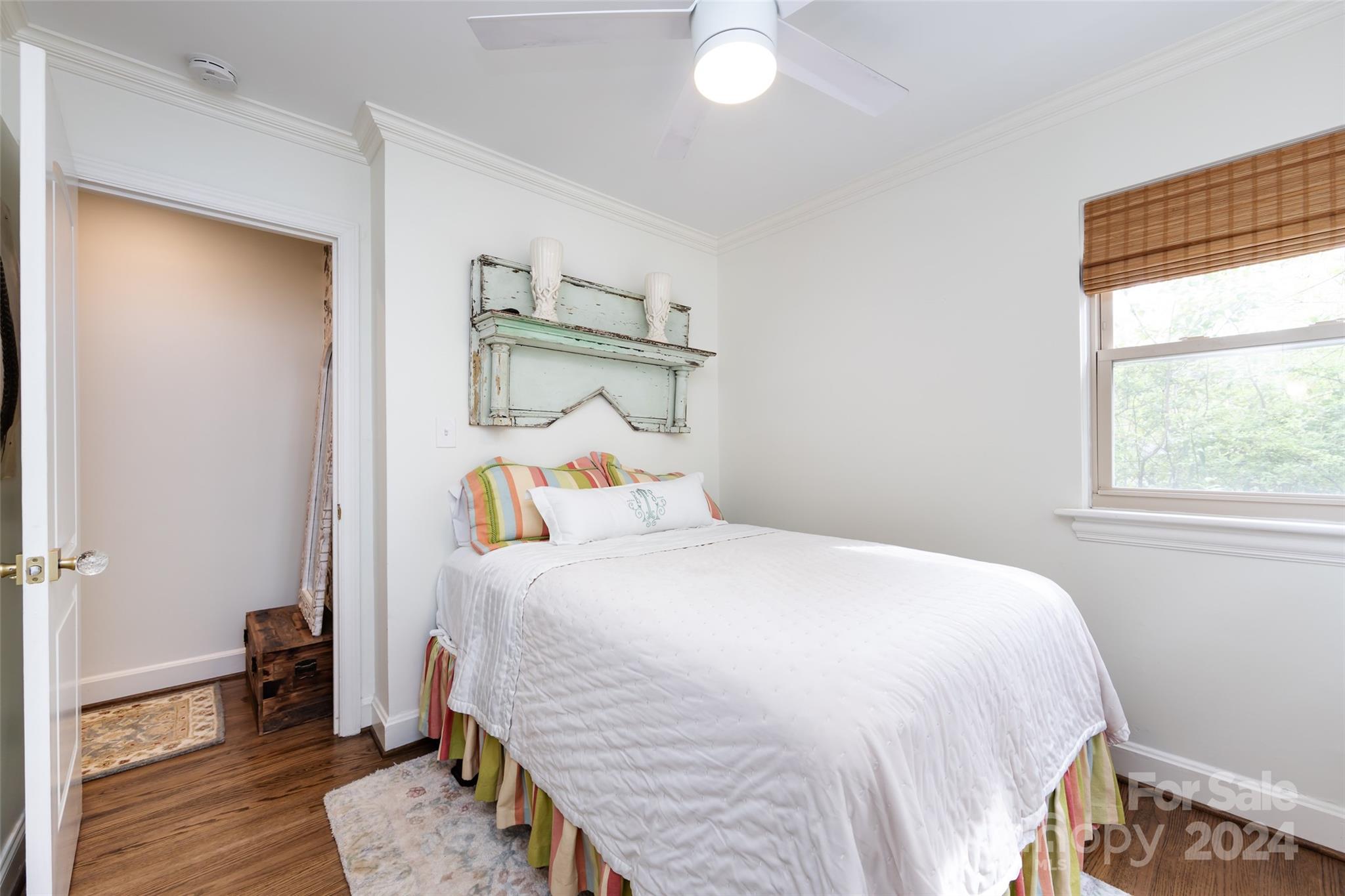 4820 Murrayhill Road Charlotte, NC 28209 - Photo 20 of 31 a bedroom with a bed and wooden floor