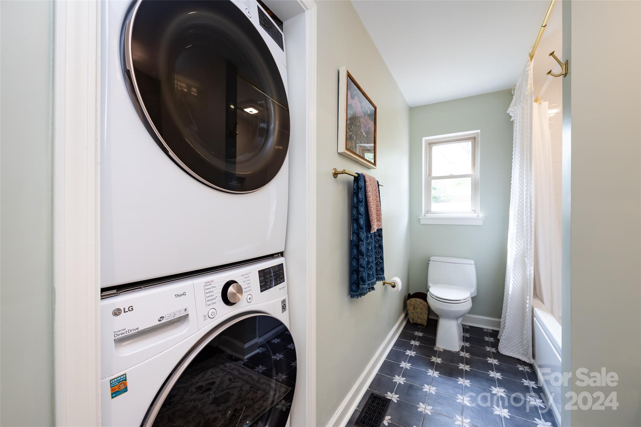 4820 Murrayhill Road Charlotte, NC 28209 - Photo 21 of 31 a view of a bathroom with washing machine and dryer