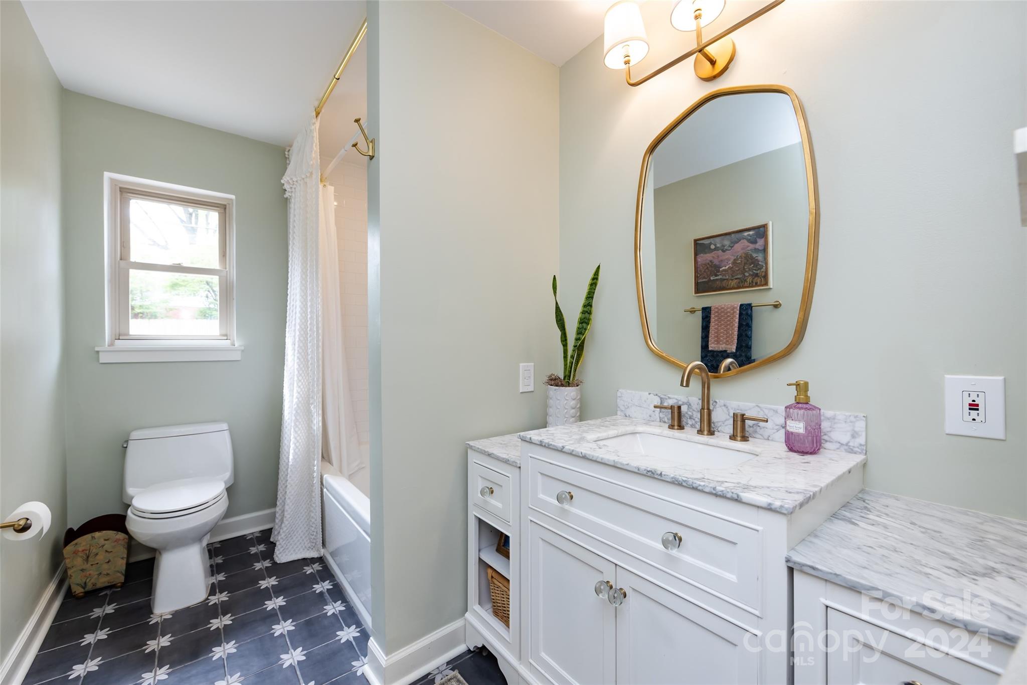4820 Murrayhill Road Charlotte, NC 28209 - Photo 22 of 31 a bathroom with a toilet sink and mirror