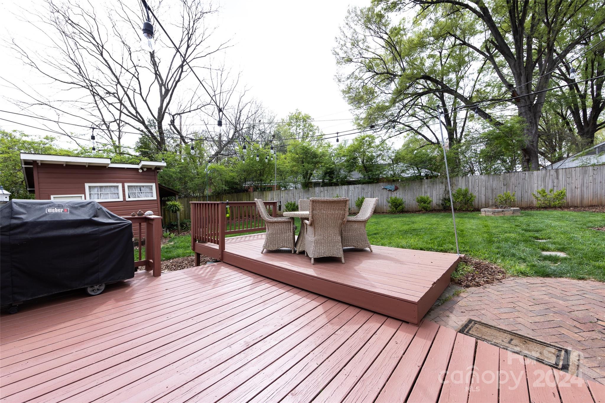 4820 Murrayhill Road Charlotte, NC 28209 - Photo 24 of 31 a view of a deck with couches with wooden floor and fence