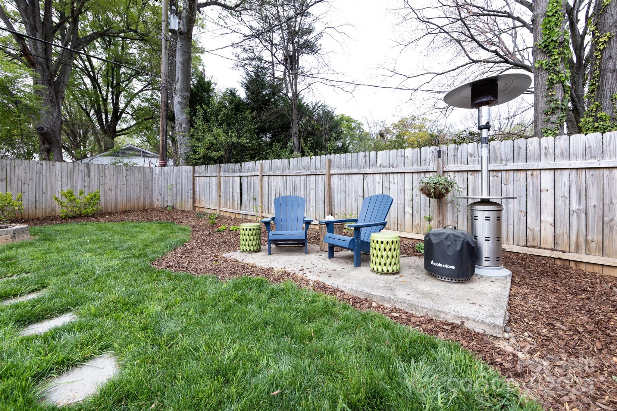 4820 Murrayhill Road Charlotte, NC 28209 - Photo 25 of 31 a view of a chair and table on the wooden deck