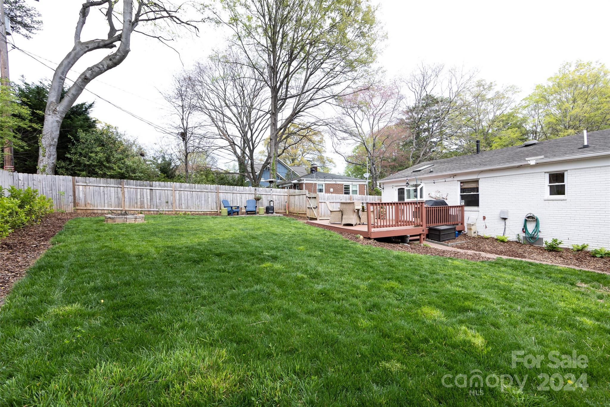 4820 Murrayhill Road Charlotte, NC 28209 - Photo 28 of 31 a view of a house with a yard and sitting area