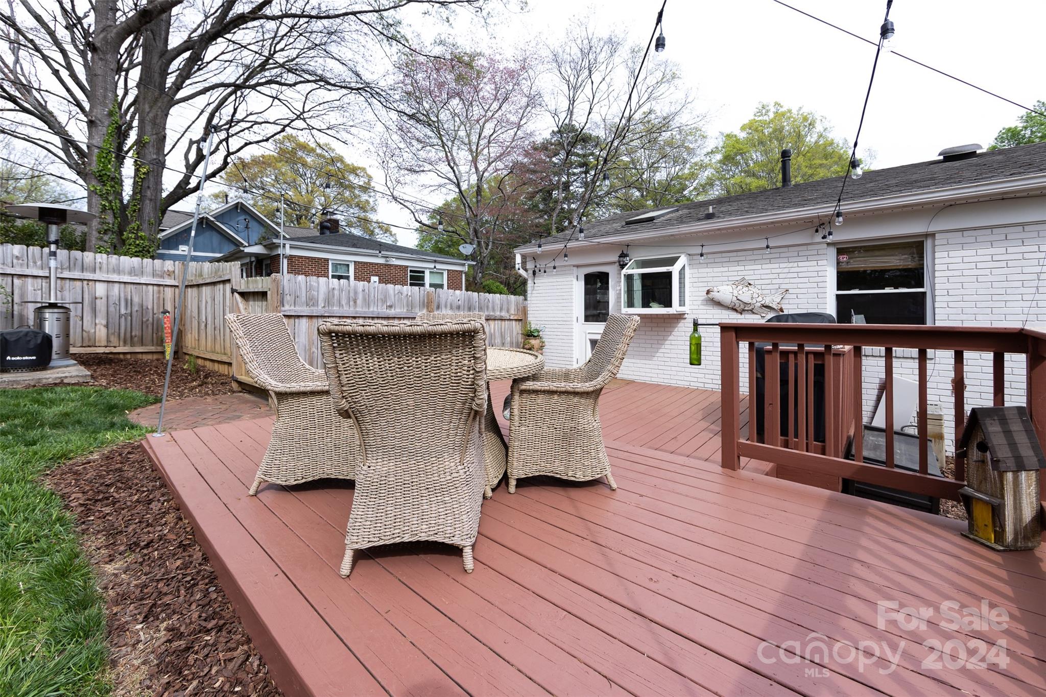 4820 Murrayhill Road Charlotte, NC 28209 - Photo 29 of 31 a view of a house with wooden deck and furniture