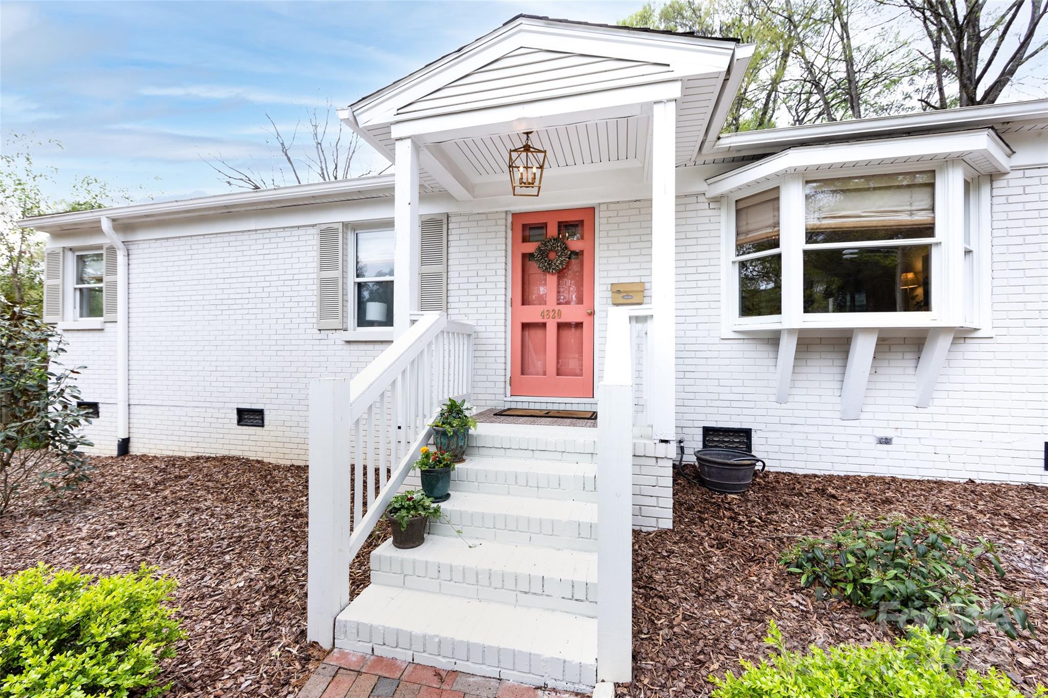 4820 Murrayhill Road Charlotte, NC 28209 - Photo 3 of 31 a front view of a house with a garden