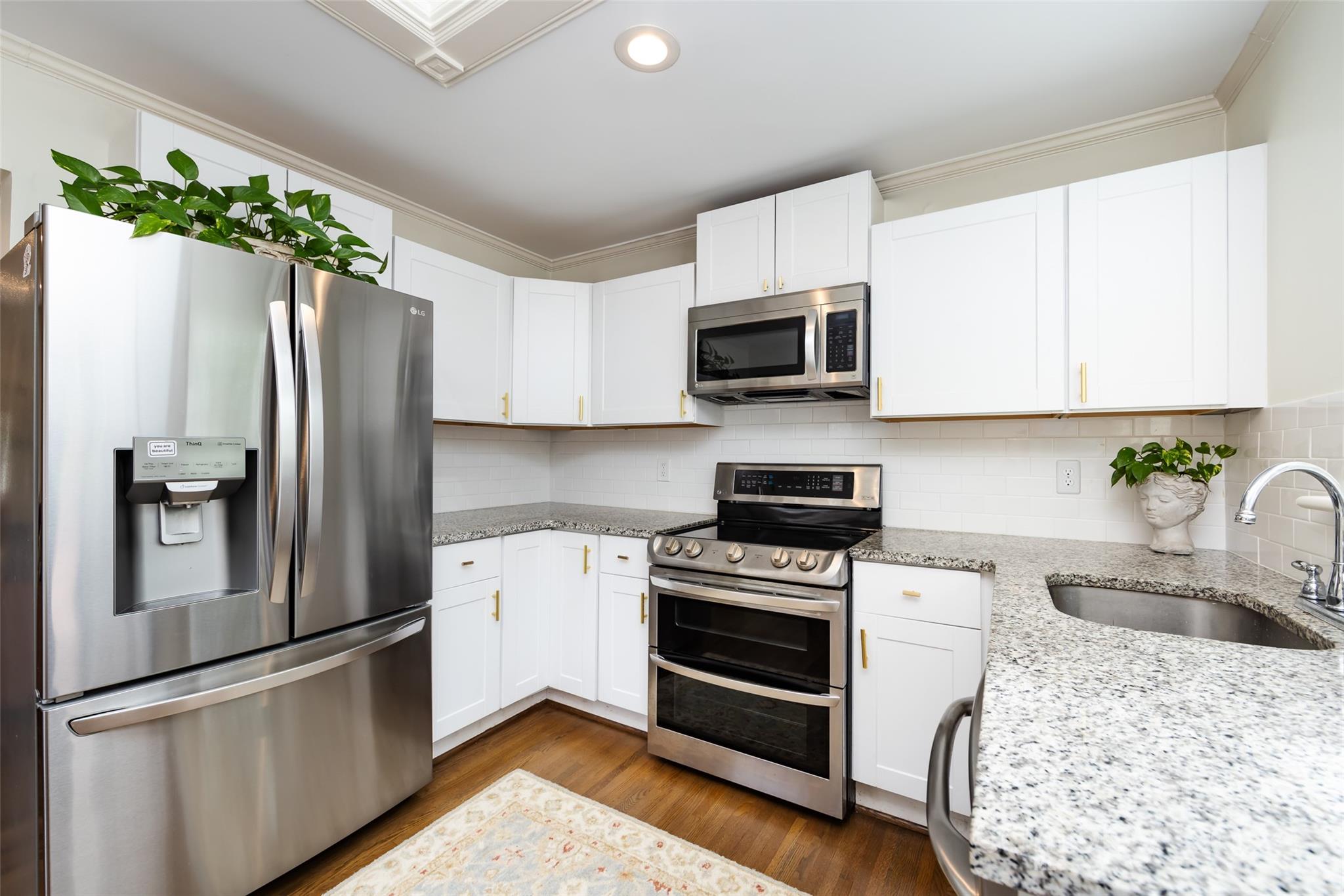 4820 Murrayhill Road Charlotte, NC 28209 - Photo 10 of 31 a kitchen with granite countertop a refrigerator stove and microwave