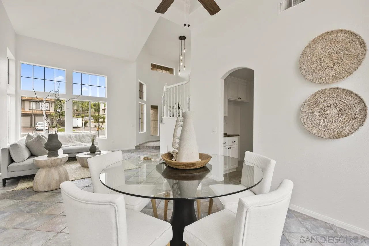 1363 Corte Alveo Oceanside, CA 92057 - Photo 12 of 62 a view of a dining room with furniture and a large window
