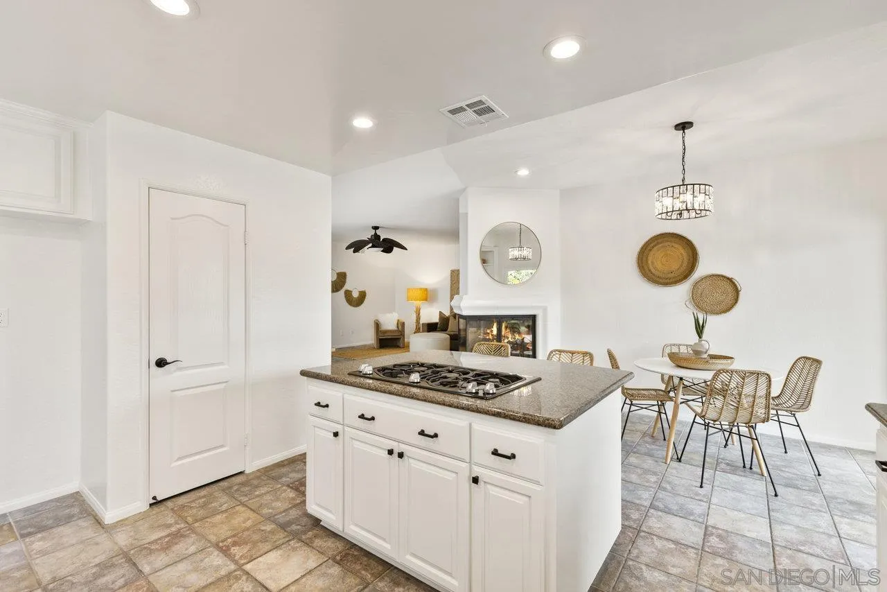1363 Corte Alveo Oceanside, CA 92057 - Photo 14 of 62 a kitchen with stainless steel appliances granite countertop a stove a sink and a refrigerator