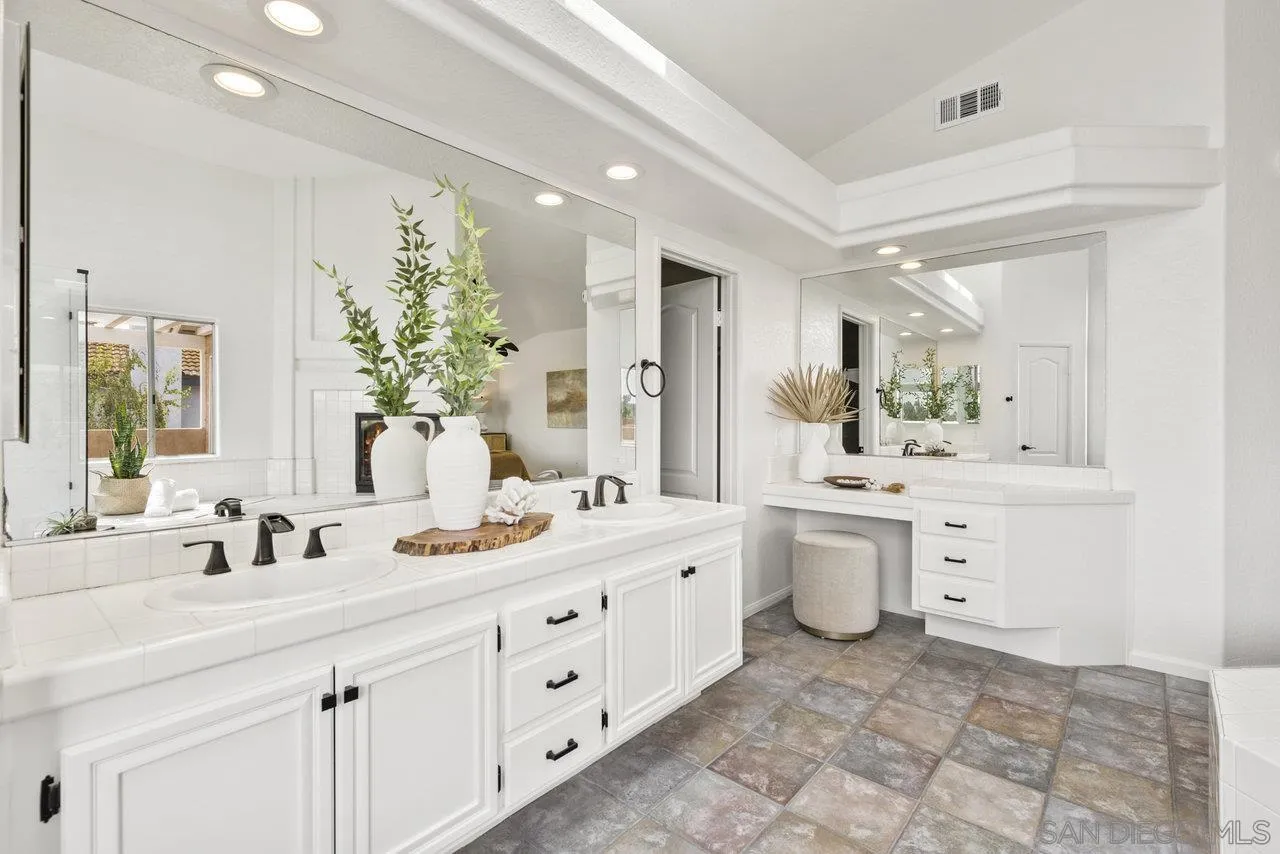 1363 Corte Alveo Oceanside, CA 92057 - Photo 36 of 62 a bathroom with a double vanity sink mirror and a