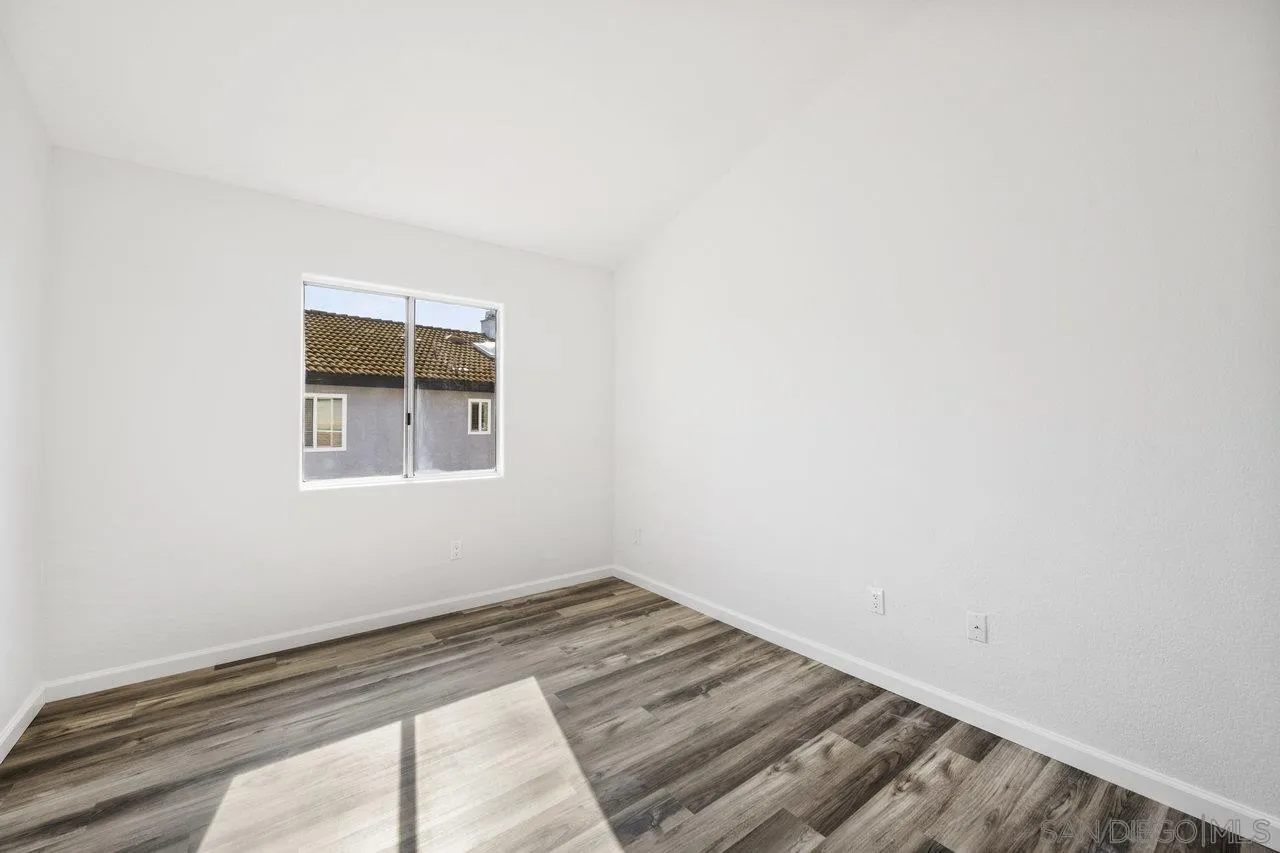 1363 Corte Alveo Oceanside, CA 92057 - Photo 42 of 62 a view of a room with wooden floor and window