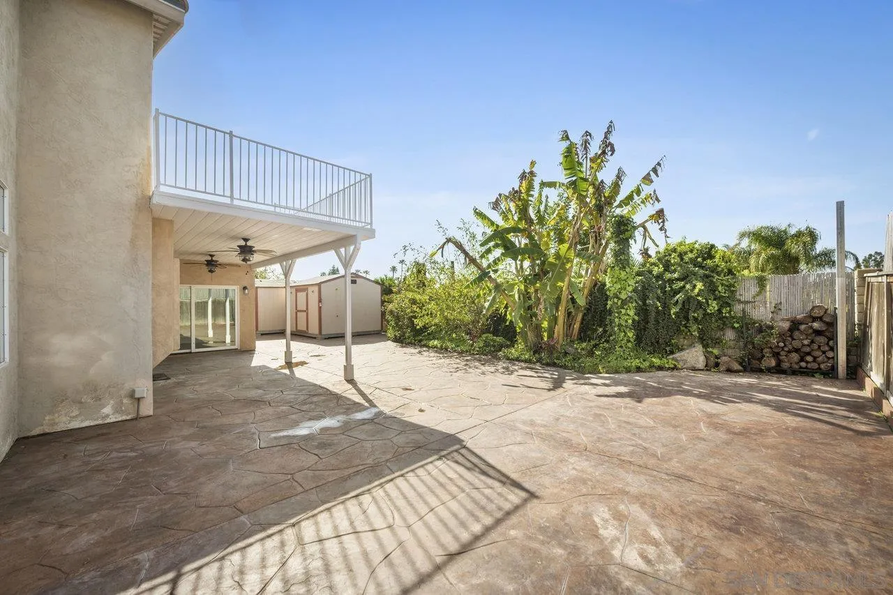 1363 Corte Alveo Oceanside, CA 92057 - Photo 52 of 62 a row of palm trees in front of a house