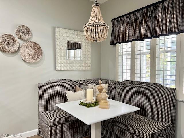 3411 Sandpiper Way Naples, FL 34109 - Photo 13 of 35 a view of a dining room with furniture