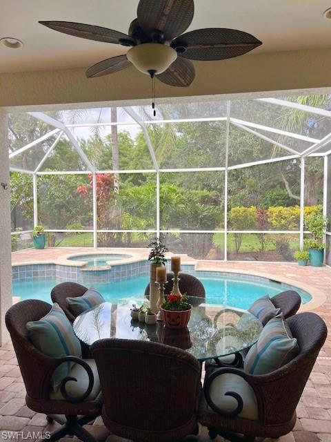 3411 Sandpiper Way Naples, FL 34109 - Photo 22 of 35 a living room with furniture and a large window