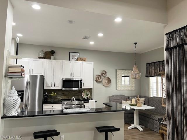 3411 Sandpiper Way Naples, FL 34109 - Photo 9 of 35 a room with furniture and a window