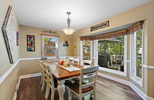 a view of a dining room with furniture window and outside view