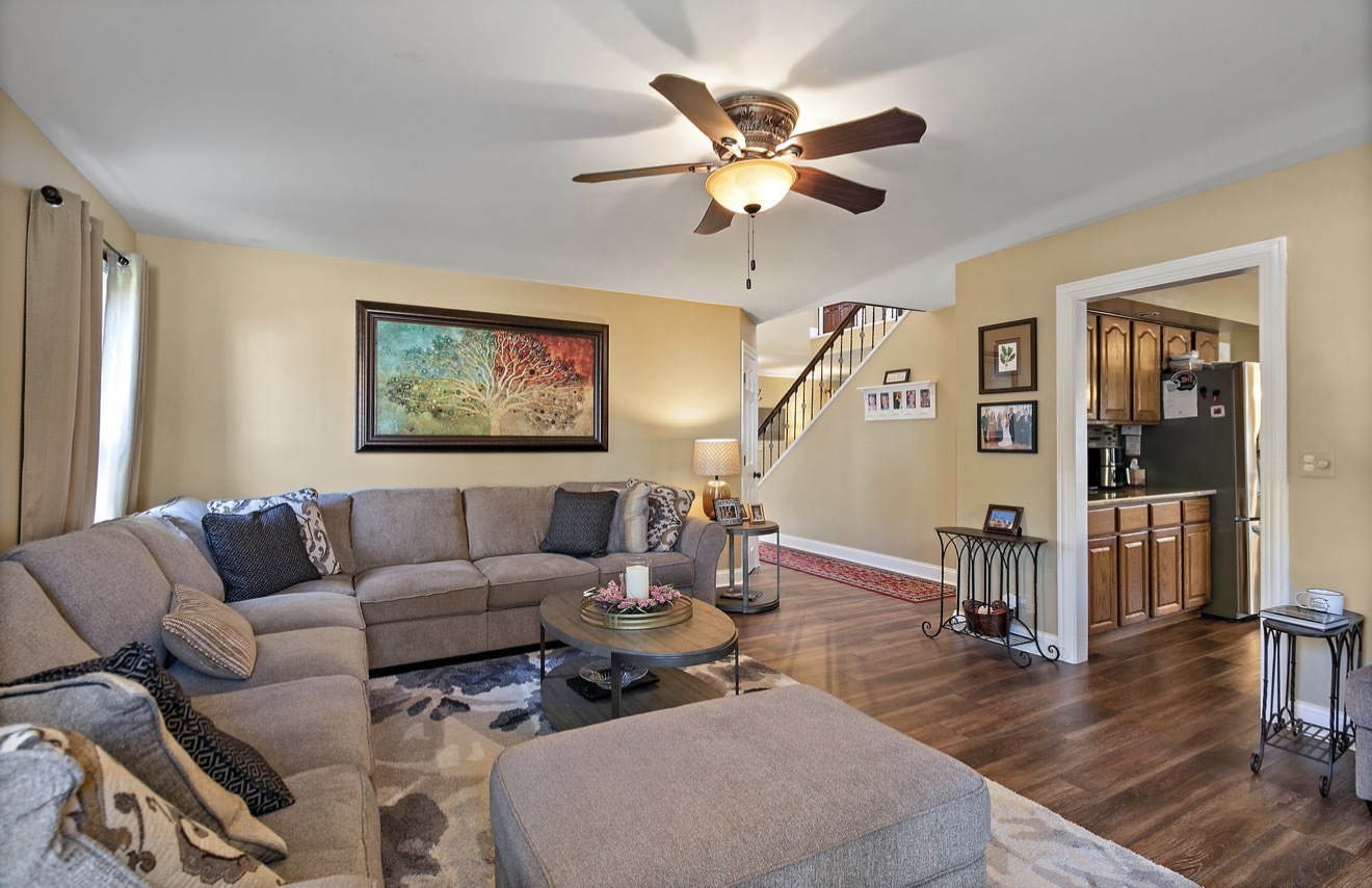11612 Becky Lee Huntley, IL 60142 - Photo 14 of 33 a living room with furniture and a wooden floor