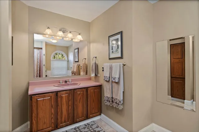 a bathroom with a sink and a mirror