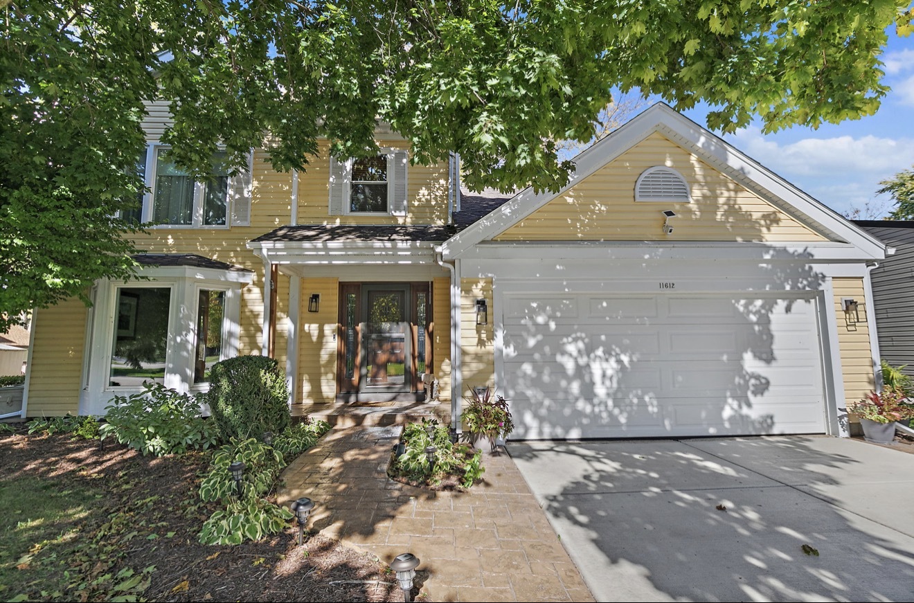 11612 Becky Lee Huntley, IL 60142 - Photo 2 of 33 a front view of a house with a yard