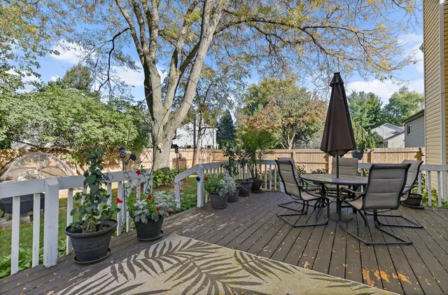 a view of a chairs and table in the patio