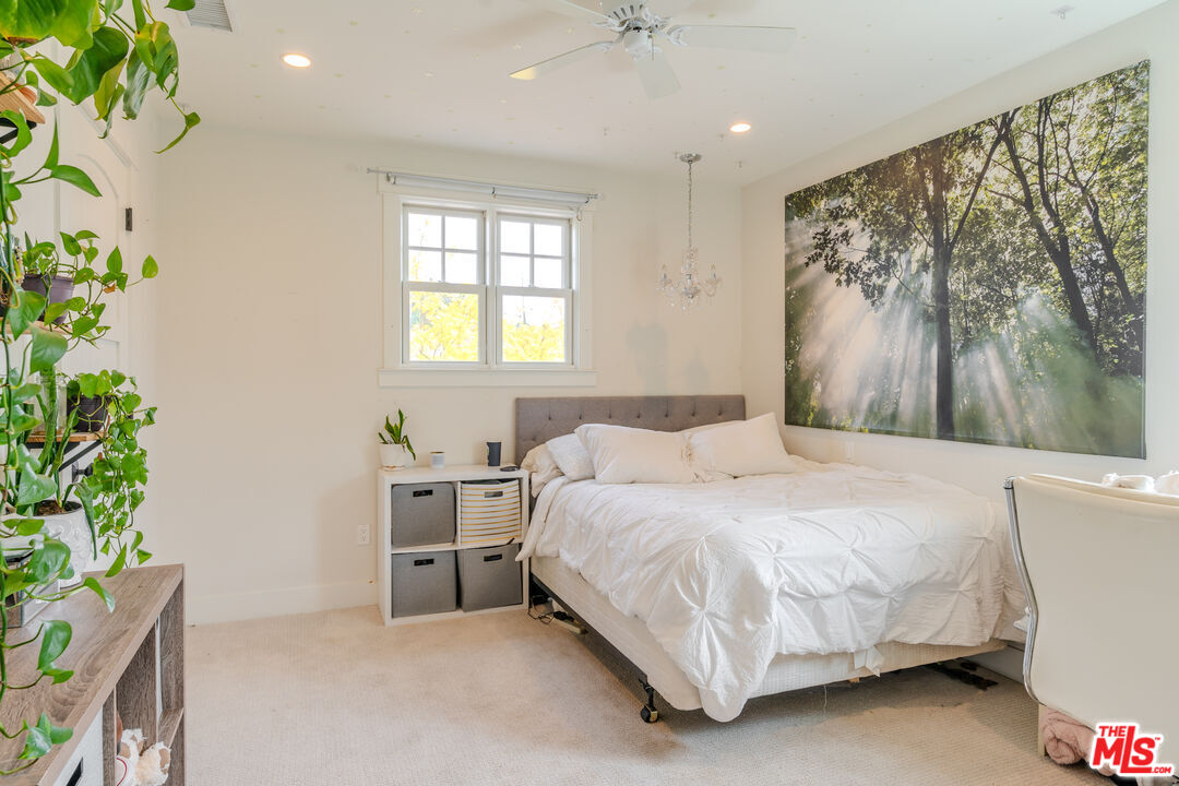 5903 Tellefson Road Culver City, CA 90230 - Photo 22 of 38 a bedroom with a bed and a potted plant