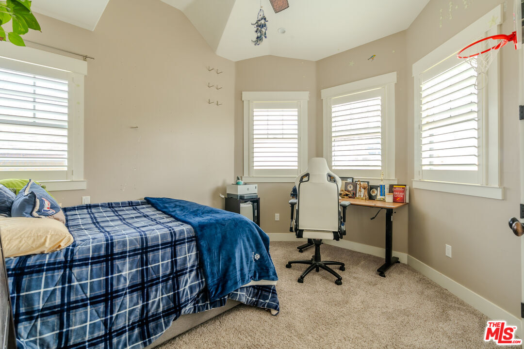 5903 Tellefson Road Culver City, CA 90230 - Photo 23 of 38 a bedroom that has a bed and a table in it