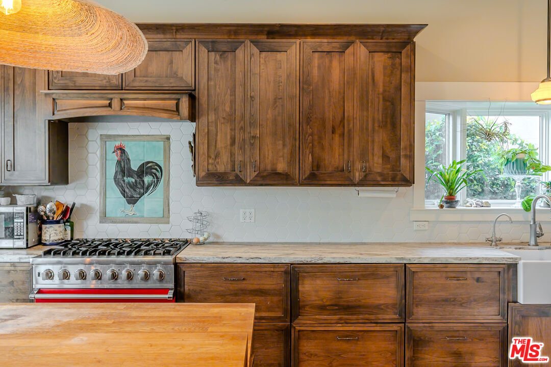 5903 Tellefson Road Culver City, CA 90230 - Photo 5 of 38 a kitchen with stainless steel appliances granite countertop a coffee maker on top of it
