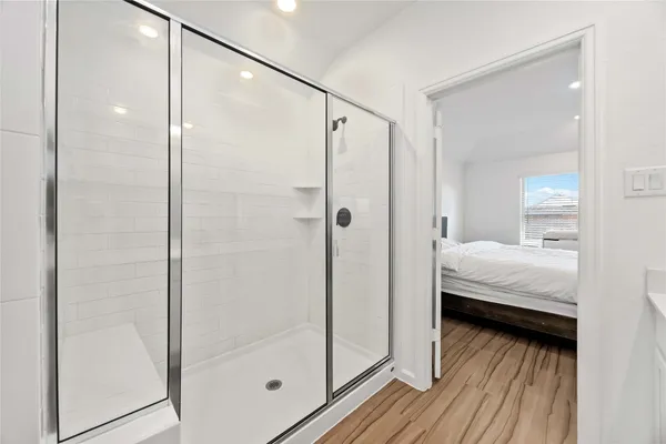 a en suite bathroom with a shower and a glass door