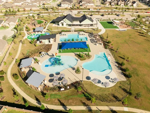 an aerial view of a house with a swimming pool