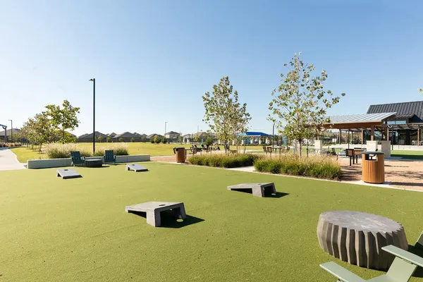 a swimming pool with outdoor seating and yard
