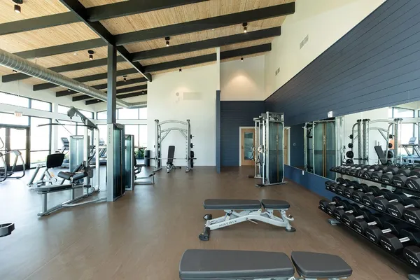 a room with lots of gym equipment
