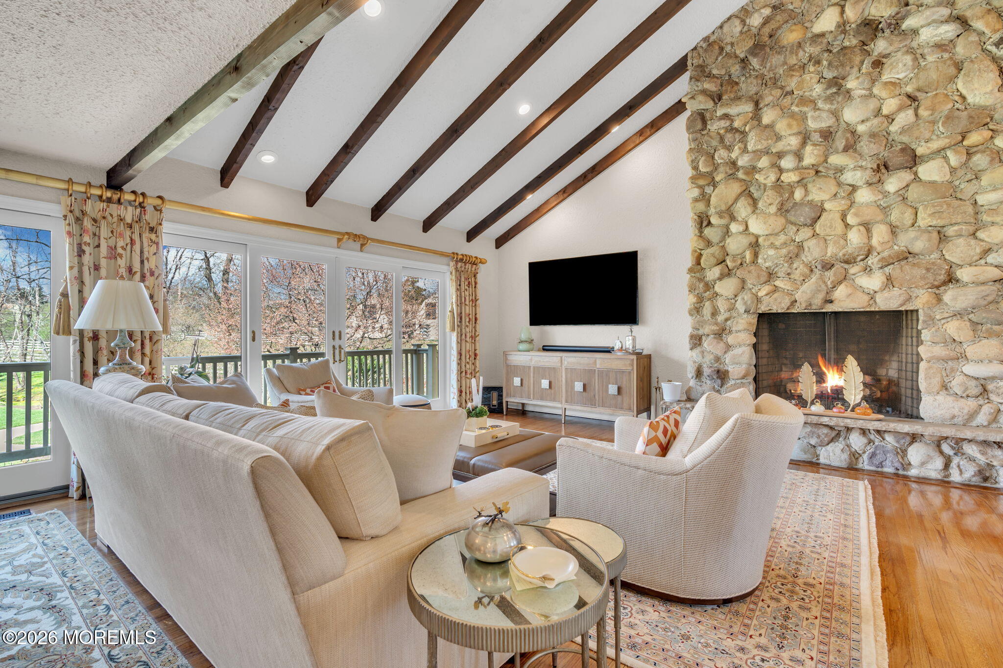 2 Alyce Lane Rumson, NJ 07760 - Photo 7 of 35 a living room with furniture a fireplace and a flat screen tv